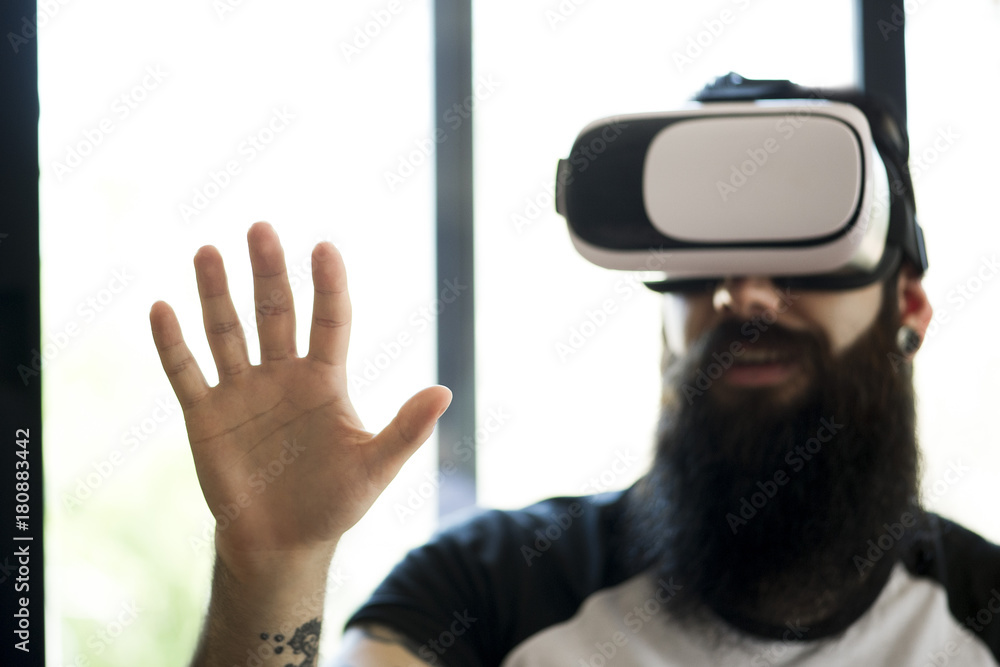 Man using virtual reality simulator Man using virtual reality simulator