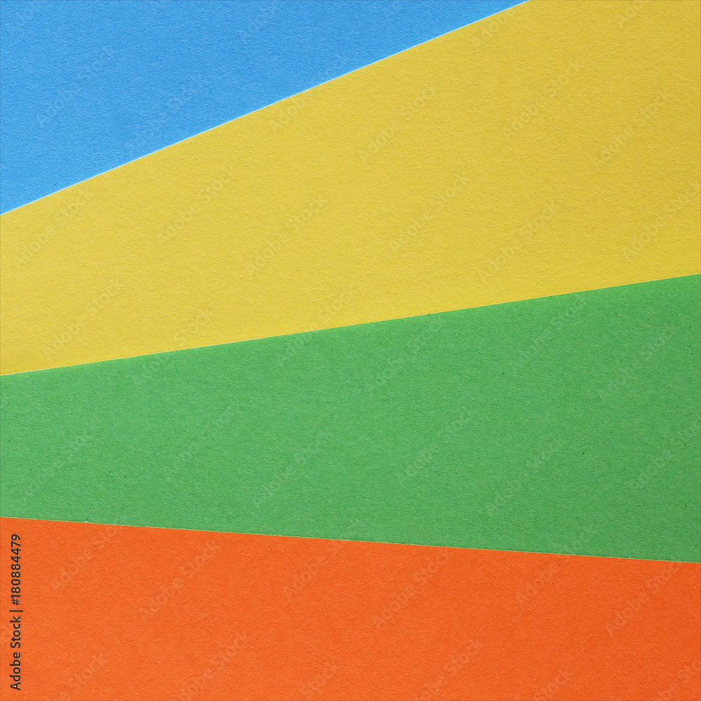 Fototapeta premium Pieces of colored torn paper as a background. copy space