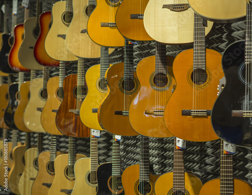 classical acoustic guitar background music shop with many guitars