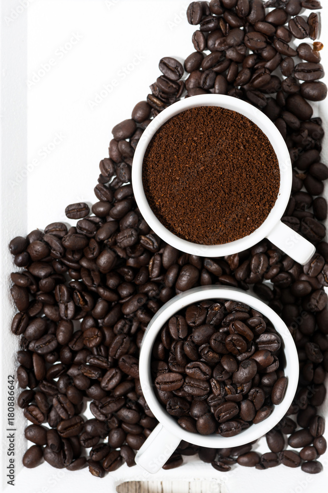 cups with ground coffee and coffee beans, vertical, top view cups with ground coffee and coffee beans, vertical, top view