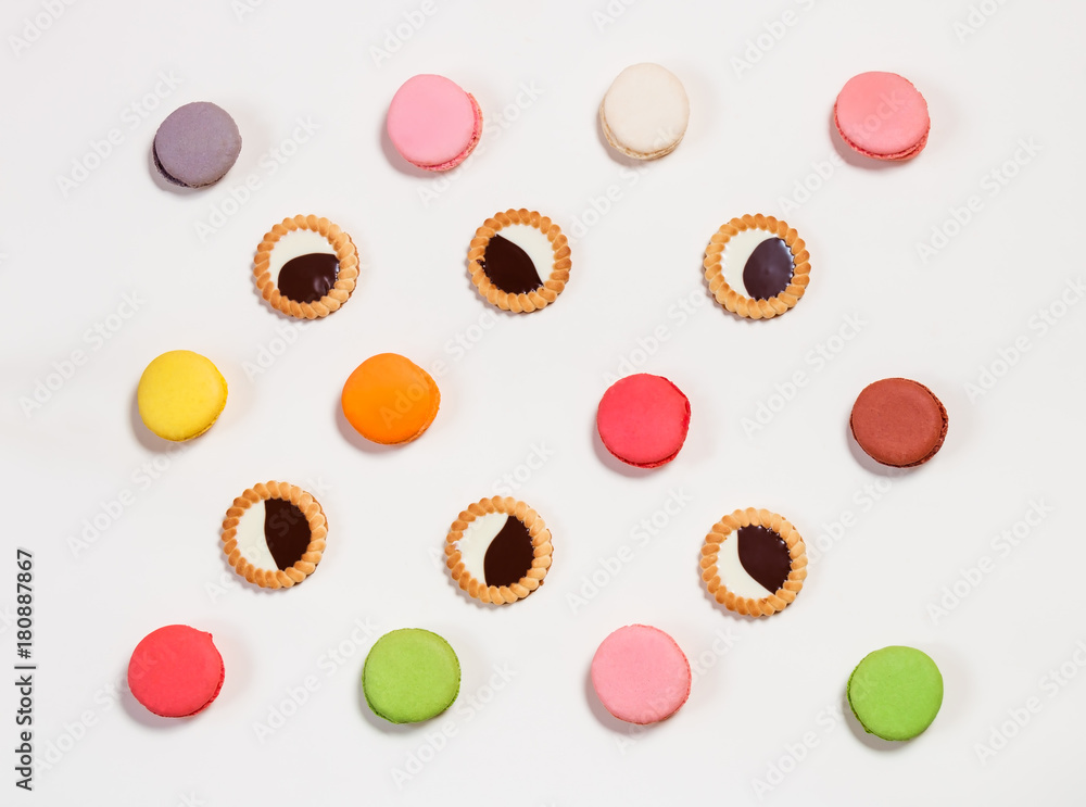 Colorful cookies pattern on beige background Colorful cookies pattern on beige background