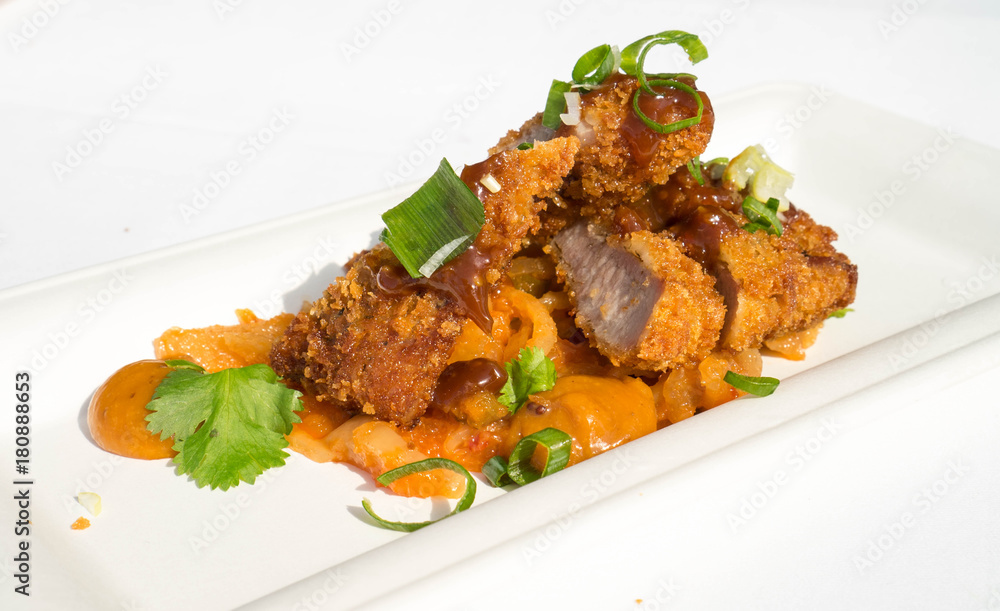 Fototapeta premium Breaded duck breast with white radish salad
