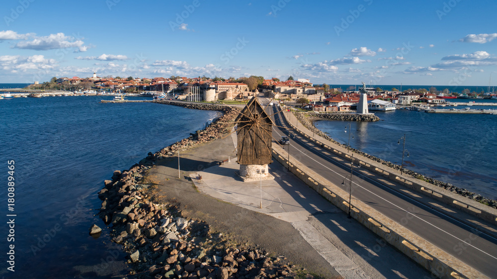 Old windmill at the entrance to the Old Town of Nessebar, ancient city on the Black Sea coast of Bulgaria. ?erial view.