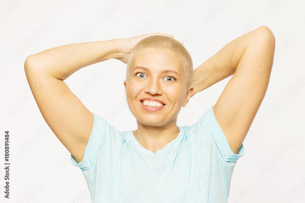 Bald young woman laughing