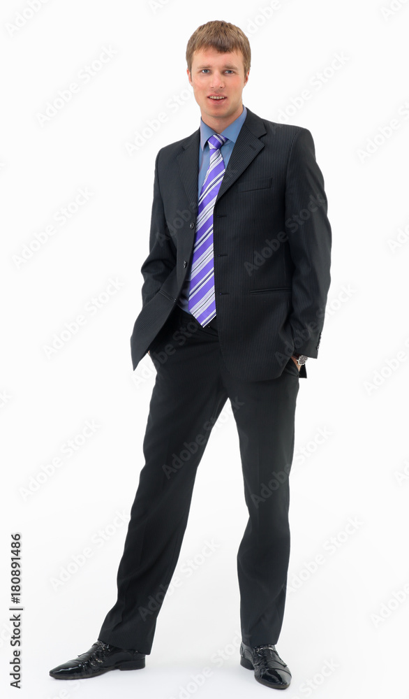 young businessman standing with hands in pockets isolated young businessman standing with hands in pockets isolated