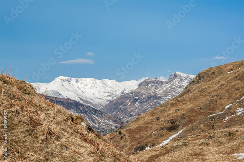 View towards snowy Langdale mountains in Lake District from Loughrigg © Malcolm