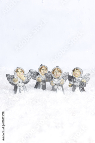 Angels choir singing for christmas in the snow