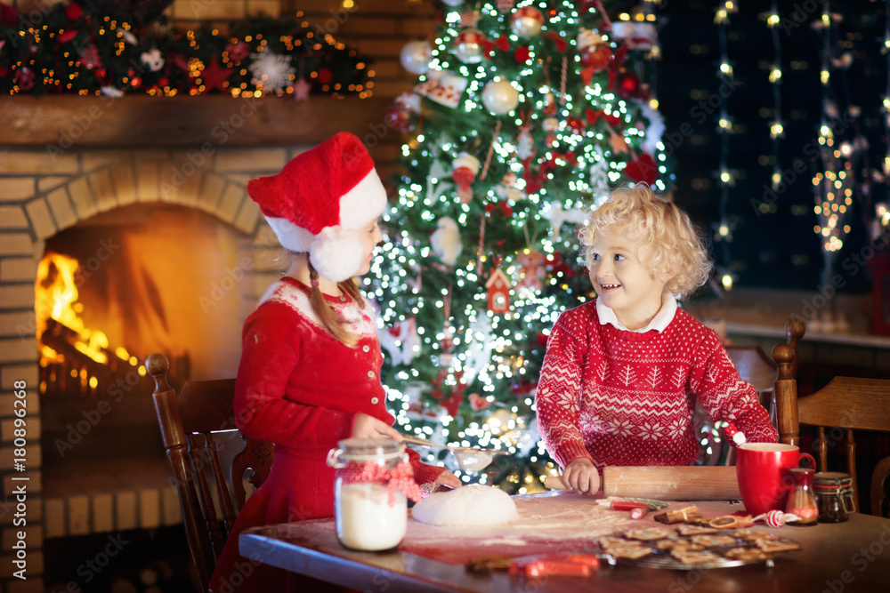Child baking Christmas cookies. Kids bake for Xmas Child baking Christmas cookies. Kids bake for Xmas