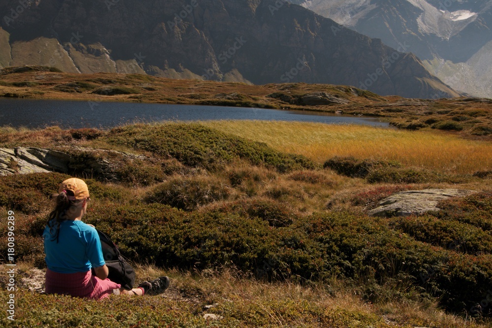 girl watching beautiful mountain landscape Pass S.Bernardino Switzerland