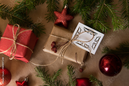 Christmas present wrapped in kraft paper with natural decoration