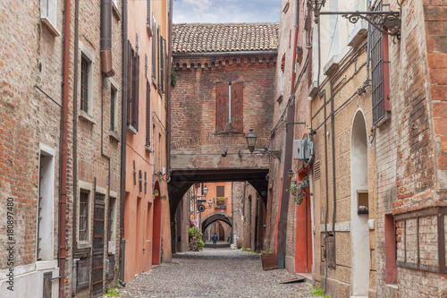 Fototapeta Naklejka Na Ścianę i Meble -  Old narrow medieval street of the center of Ferrara