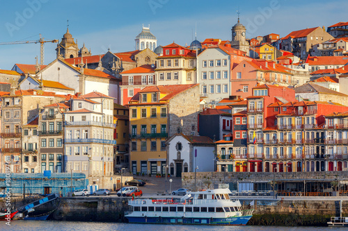 Porto. Multicolored houses on the waterfront of the Douro River. © pillerss