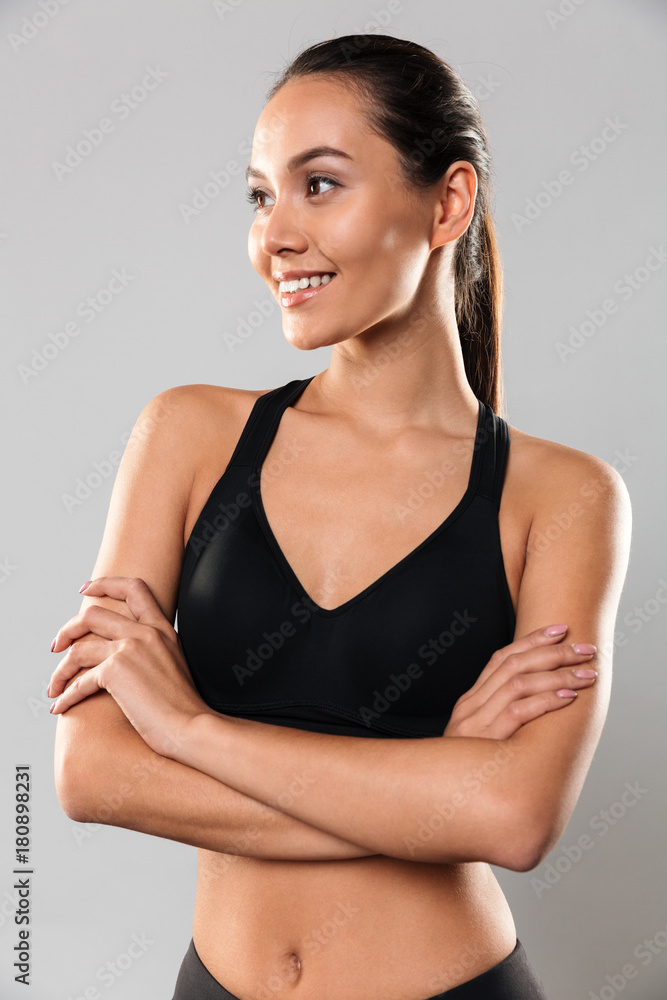 Amazing young sports woman posing isolated Amazing young sports woman posing isolated