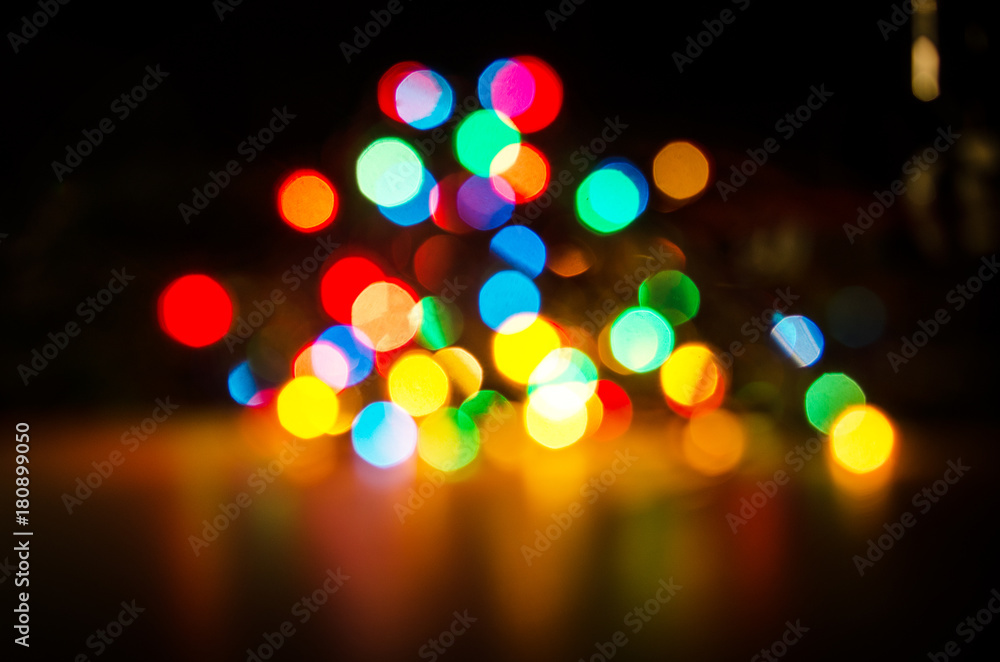 Deliberately blurred Christmas color lights in the background. Deliberately blurred Christmas color lights in the background.