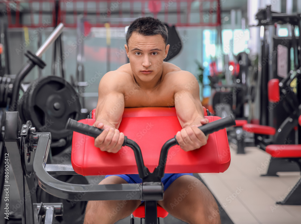 Muscular man training in gym Muscular man training in gym