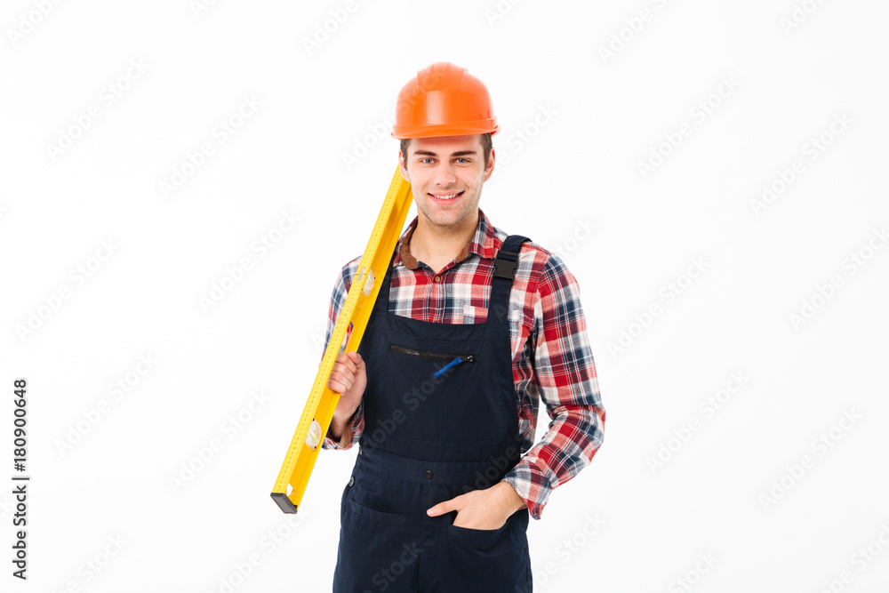 Full length portrait of a smiling young male builder Full length portrait of a smiling young male builder