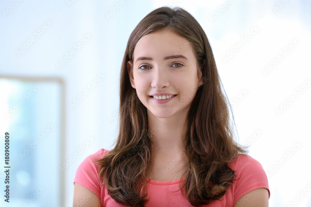 Attractive teenage girl indoors
