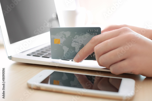 Woman with credit card and ...