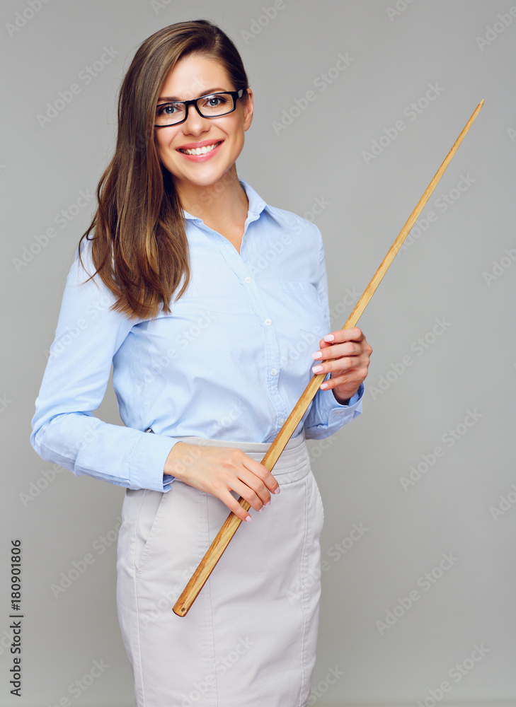 Woman classic smiling teacher holding wooden pointer. Woman classic smiling teacher holding wooden pointer.