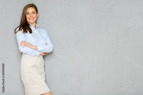 Successful busineswoman portrait on office wall background. photo