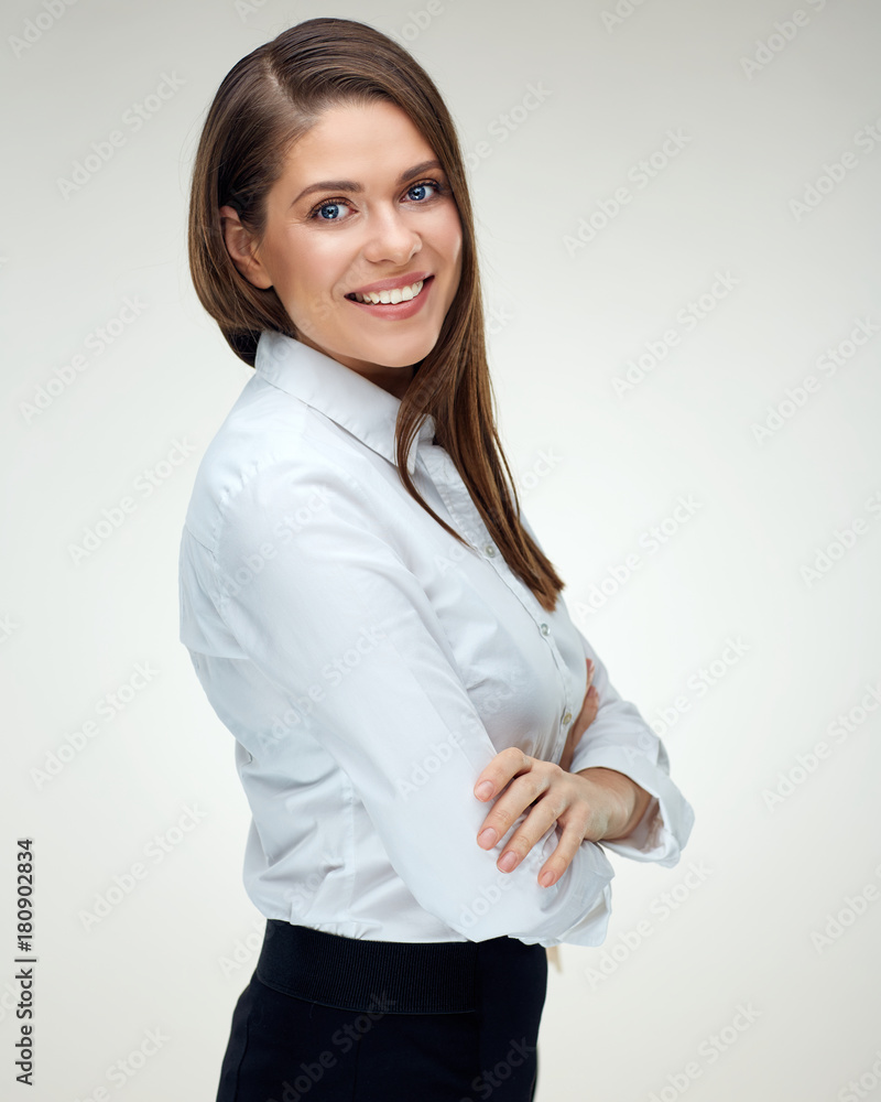 Business woman with long hair standing with crossed arms. Business woman with long hair standing with crossed arms.