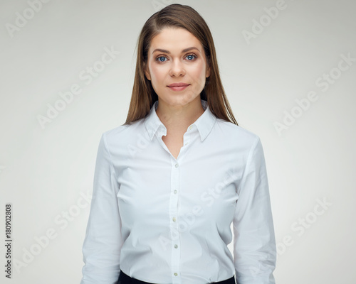 Serious bisinesswoman isolated studio portrait. Woman in white shirt with long hair. photo