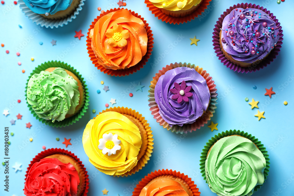 Tasty cupcakes on color background Tasty cupcakes on color background