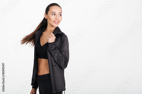 Happy young sports lady running isolated