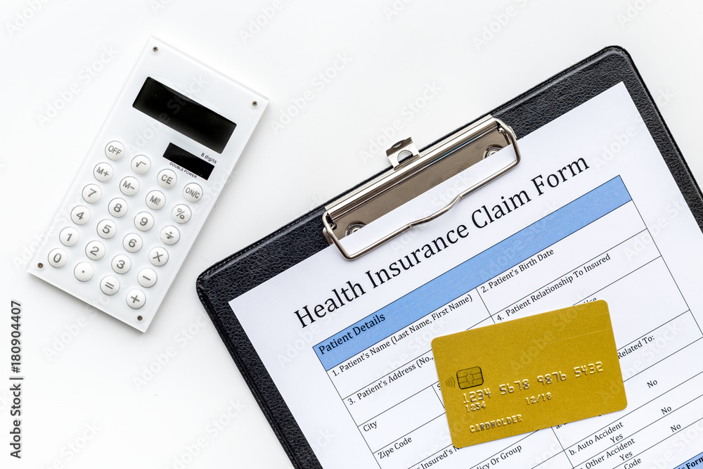 Buy health insurance. Document, bank card and calculator on white background top view Buy health insurance. Document, bank card and calculator on white background top view