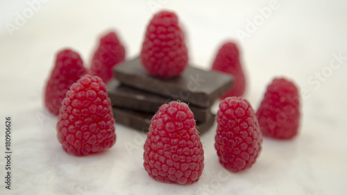 Raspberries and Chocolate Stack on a Marble Background Horizontal