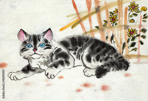 Foto spotted kitten near the fence