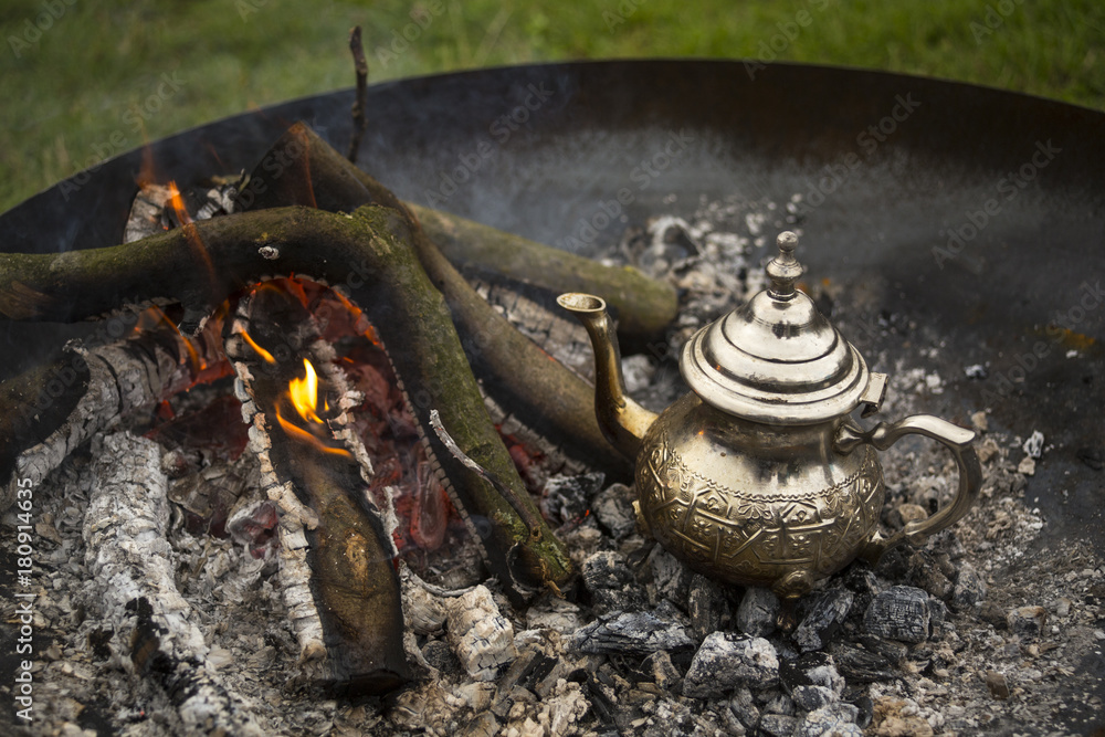 A traditional way of making Maroccan mint tea on an open fire A traditional way of making Maroccan mint tea on an open fire