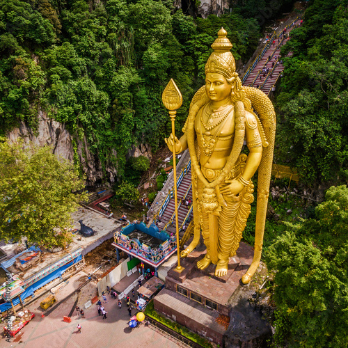 Batu Caves near Kuala Lumpur, Malaysia, aerial view of Lord Murugan statue and entrance to the famous cave temples.