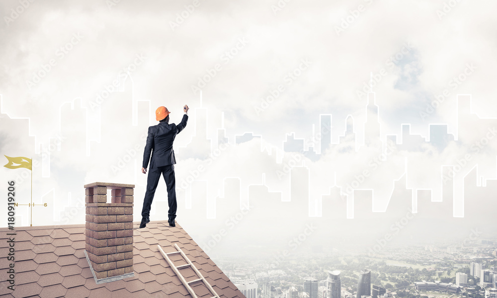 Man architect draw silhouette of modern city on blue sky. Mixed Man architect draw silhouette of modern city on blue sky. Mixed
