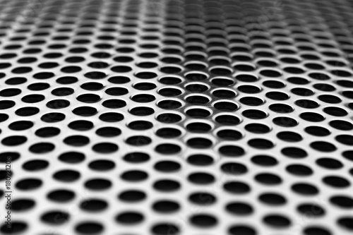 metal grid with round cell close-up as background or texture under the inscription with blurred edges