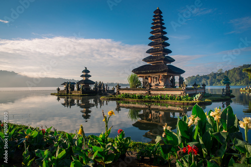 Pura Ulun Danu Bratan temple with flowers at sunrise