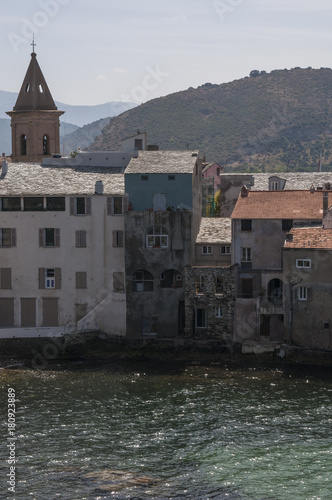 Corsica, 29/08/2017: lo skyline e il porto turistico di Saint-Florent (San Fiorenzo), popolare villaggio di pescatori sulla costa ovest dell'Alta Corsica, chiamato la Saint-Tropez corsa photo