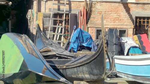 Wallpaper Mural 14590_Old_and_new_Venetian_gondolas_on_the_yard_of_the_house.mov Torontodigital.ca