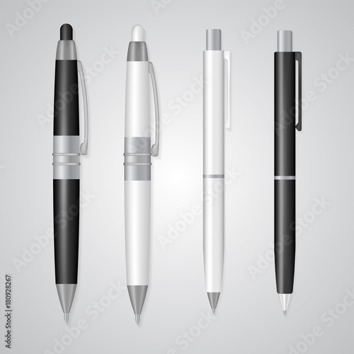 Set of realistic 3d pens made in classic white and black colors with silver details isolated on white. Writing tools with empty space for branding, corporate logo, design mock up. Business symbol.