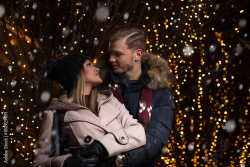 Romantic Couple Kissing at Christmas Market