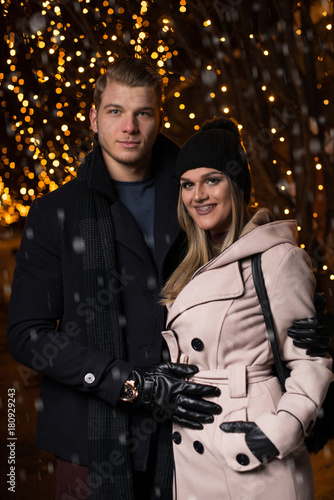 Happy Couple Holding Hands at Christmas Market