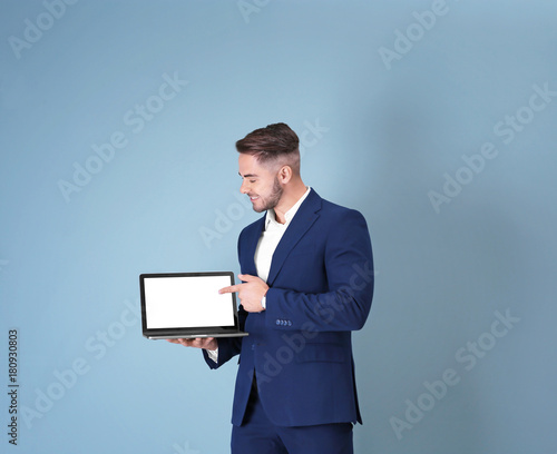 Young man with laptop again...