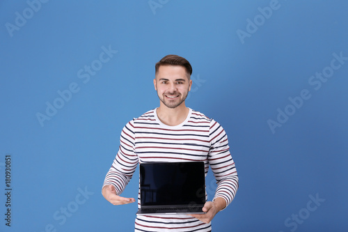 Young man with laptop again...