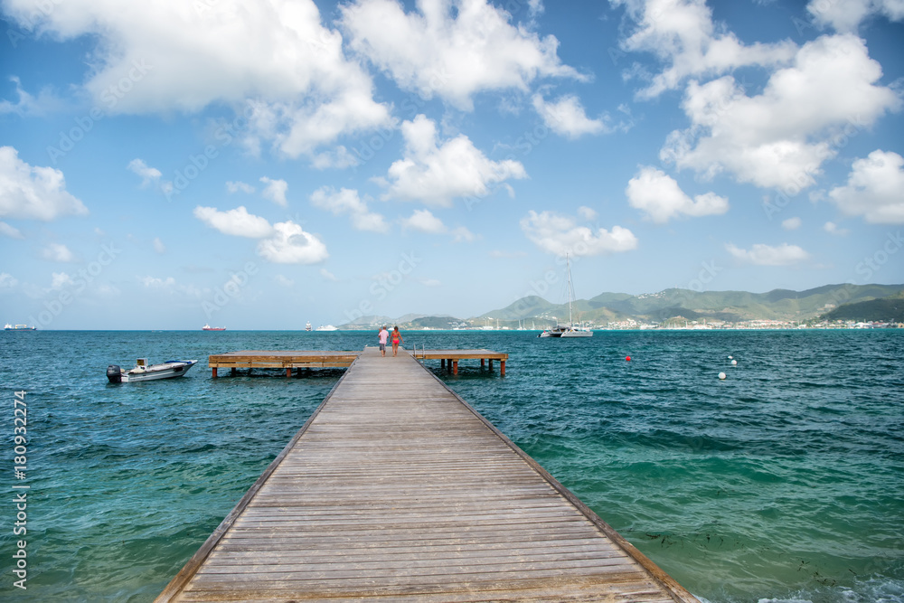 Pier with wooden deck in sea in Philipsburg, St Maarten
