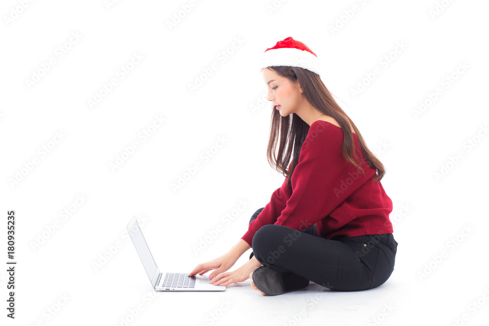 Young woman wear santa hat sitting labtop with internet shopping in season christmas holiday, girl shoping online on notebook in xmas, celebration concept. Young woman wear santa hat sitting labtop with internet shopping in season christmas holiday, girl shoping online on notebook in xmas, celebration concept.
