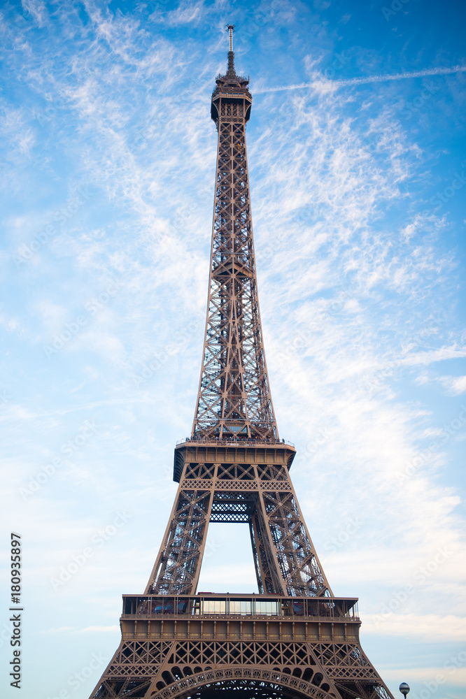 Eiffel Tower at sunset in Paris, France. HDR. Romantic travel background.