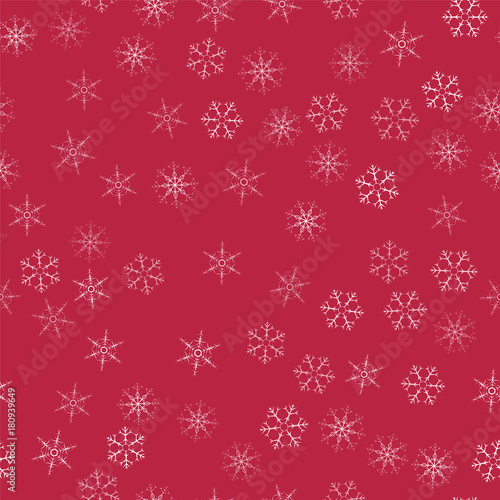 abstract seamless pattern Christmas background of snowflakes on a red. For design of cards, invitations, greeting for the new year.