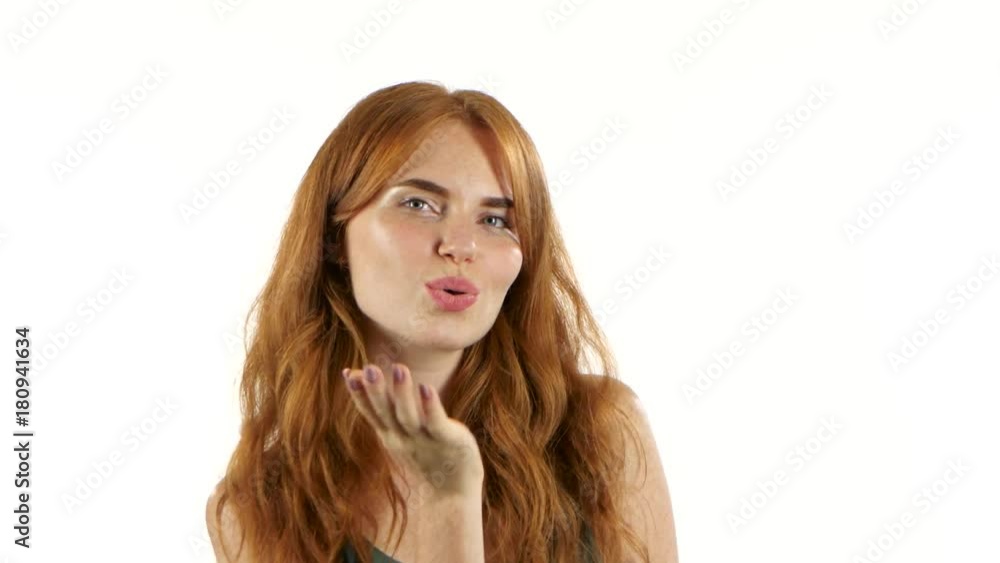 Girl is making faces and fooling around. White background Girl is making faces and fooling around. White background