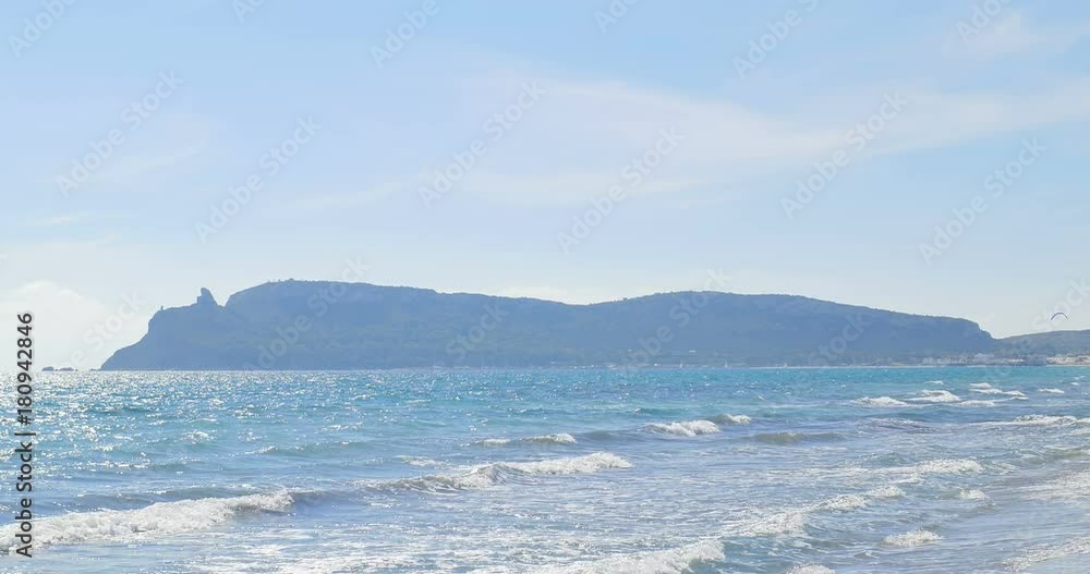 Waves landing on sandy beach. Clear blue water Waves landing on sandy beach. Clear blue water