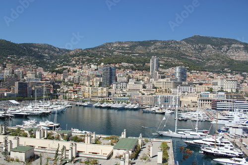 view of the port in Monaco and coastline with boats and buildings © MaryKHM